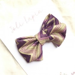 Crossed purple zigzags bows