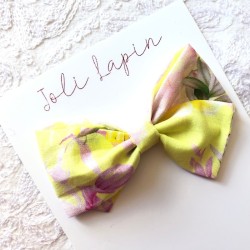 Crossed yellow & pink bow