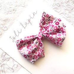 Crossed fuchsia floral bow
