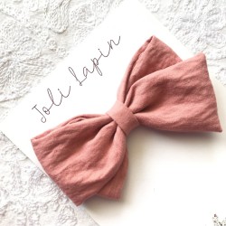 Crossed coral pink bow