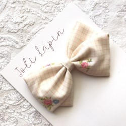 Crossed pink checkered bow