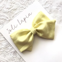 Crossed plain yellow bow