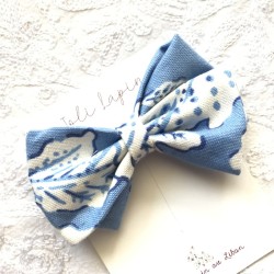Crossed light blue printed bow