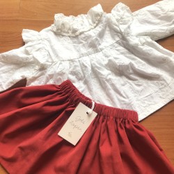 White shirt + red corduroy...
