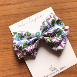 Crossed floral purple bow...