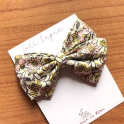 Crossed floral yellow bow...